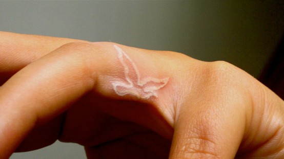  white ink-fingers Bird Tattoo 