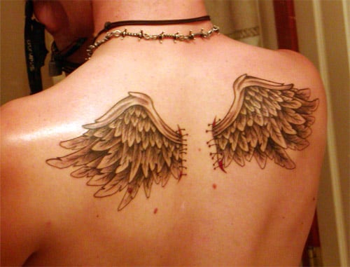 small angel wing tattoo on-the-upper-back