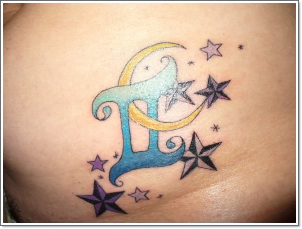 gray ink-nautical-star-and-blue-Gemini tattoo on page
