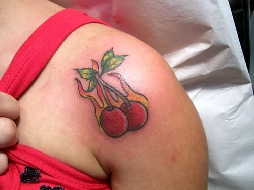  flaming -cherry tattoo on shoulder 