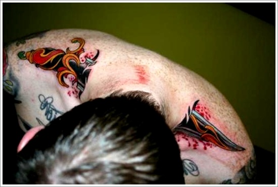 Daggers or knives tattoo design, idea 11