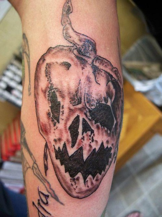 Evil looking pumpkin tattoos design, idea 14
