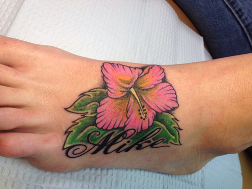 Tattoos with the hibiscus flower in their design, idea 24