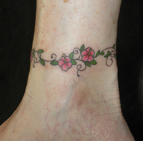 Tattoos with the hibiscus flower in their design, idea 25