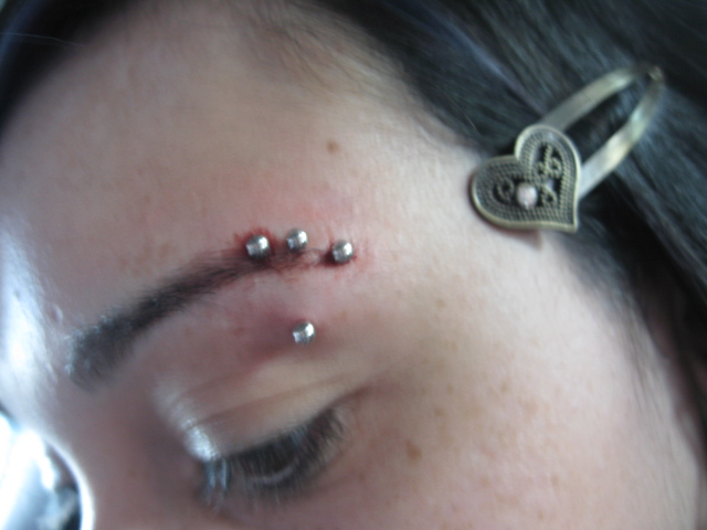 Different ways sport eyebrow piercing design, idea 7