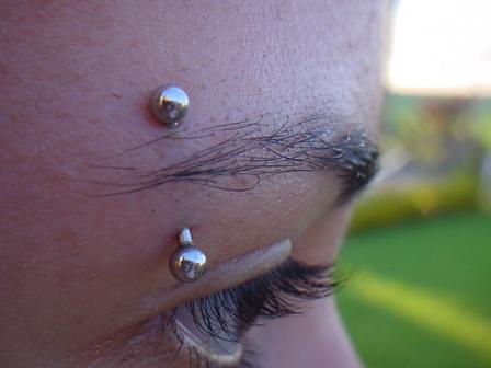 Different ways sport eyebrow piercing design, idea 3