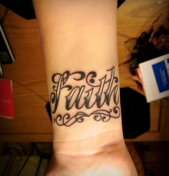 Lettering faith cross tattoo located on the wrist