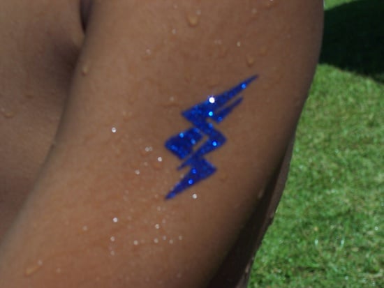 Hand and lightning bolt tattoo on the neck  Tattoogridnet