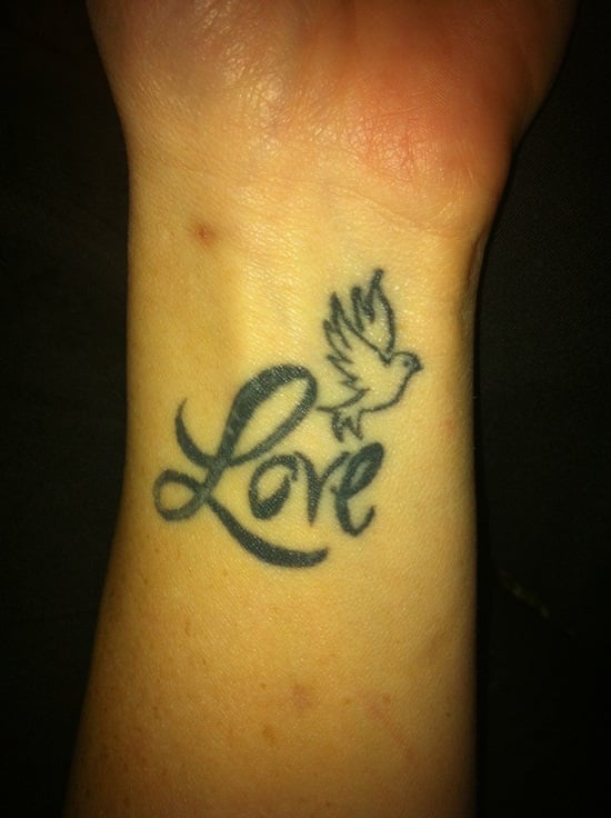 name tattoo with unconditional love symbol  Name tattoo designs Heart  tattoos with names Tattoo lettering