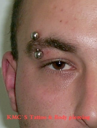 Corkscrew eyebrow hotsell piercing