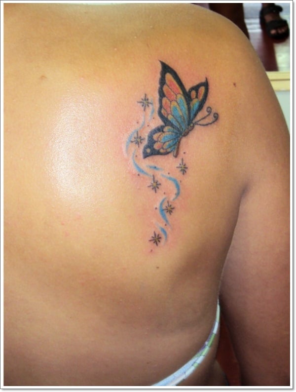 Fine line butterfly tattoo located on the upper back