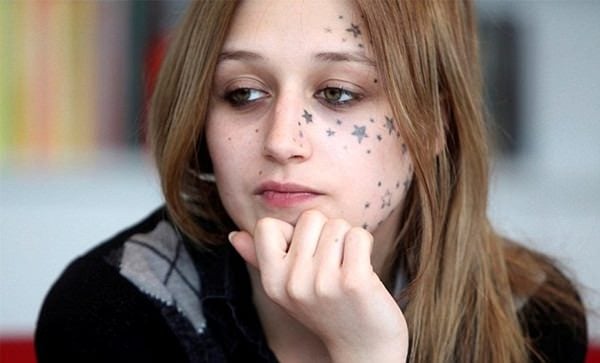 Kimberly Vlaminck, who wanted three stars tattooed on her face and got 56