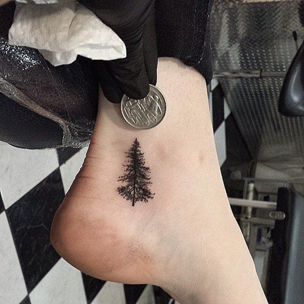 Microrealistic pine tree tattoo on the ankle