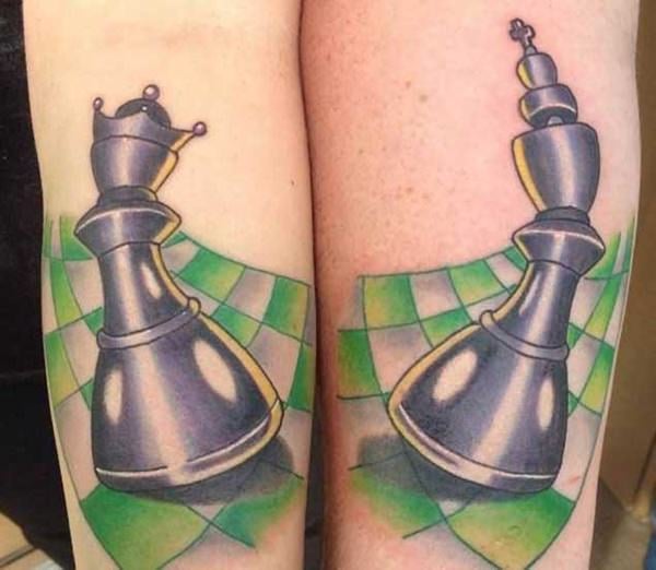 Matching king and queen chess pieces tattooed for