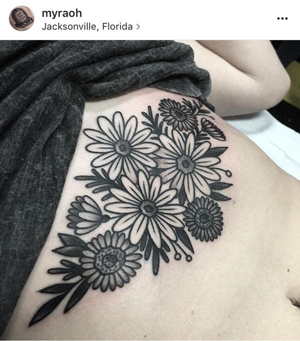 Flower tattoo on the sternum