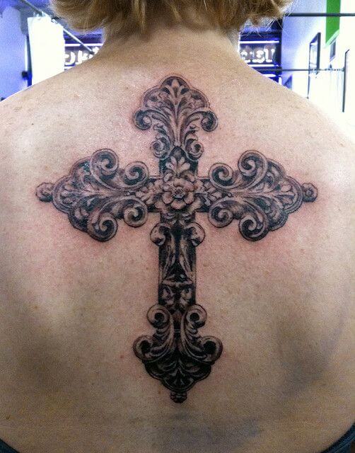 Lewis Hamiltons back tattoo of a cross and angel wings