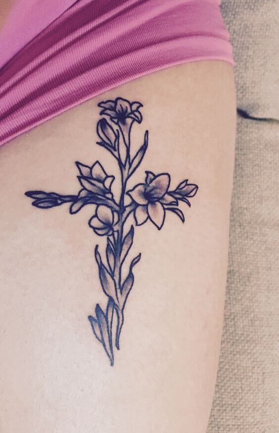 FIne line flower cross tattoo on the ankle